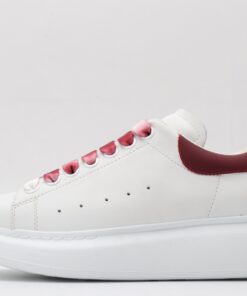 ALEXANDER MCQUEEN oversized sneakers with red heel