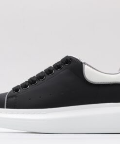 ALEXANDER MCQUEEN oversized black sneakers with white heel